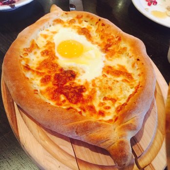 Suliko Restaurant - Boat shape cheesy pastry with egg, the cheese is very thick, comforting! - Russian Near Me - Concord, Ontario Suliko Restaurant - Boat shape cheesy pastry with egg, the cheese is very thick, comforting! - Russian Near Me - Concord, Ontario