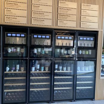 Region - a row of wine coolers in a store - Wine Bars Near Me - San Luis Obispo, California Region - a row of wine coolers in a store - Wine Bars Near Me - San Luis Obispo, California