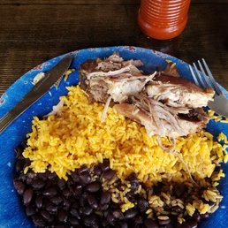Pernil, yellow rice and black beans Pernil, yellow rice and black beans