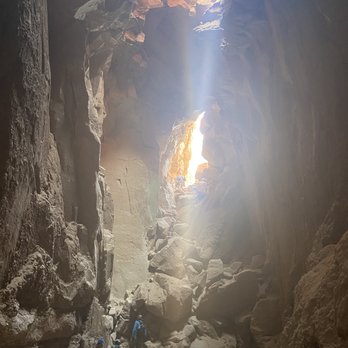 Get In The Wild Adventures - The view looking out of the goblins lair after the rappel - Hiking Near Me - Hanksville, Utah Get In The Wild Adventures - The view looking out of the goblins lair after the rappel - Hiking Near Me - Hanksville, Utah