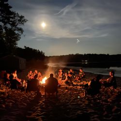 Camp Pinewood YMCA - A farewell campfire on the beach