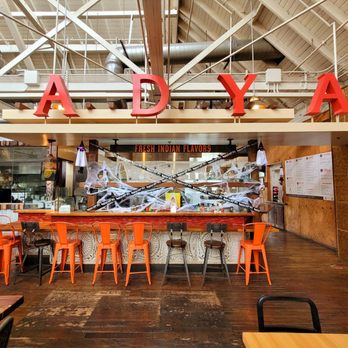 ADYA - the inside of a restaurant with orange chairs - Indian Near Me - Anaheim, California ADYA - the inside of a restaurant with orange chairs - Indian Near Me - Anaheim, California