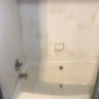 Prestige Resurfacing - Before pic with stained tile and stained/peeling floors - Refinishing Services Near Me - Atlanta, Georgia