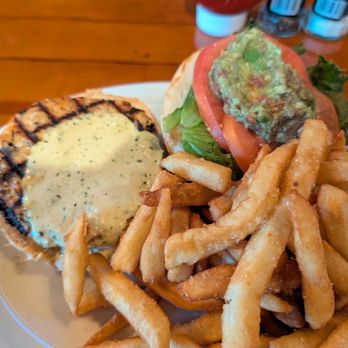 The Quarterdeck Restaurant - A salmon burger with the fixings and a side of fries - Seafood Near Me - Falmouth, Massachusetts The Quarterdeck Restaurant - A salmon burger with the fixings and a side of fries - Seafood Near Me - Falmouth, Massachusetts
