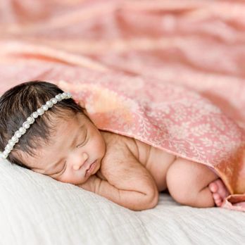 Isabel Sweet Photography - Newborn baby girl sleeping with mother's pink saree. - Session Photography Near Me - Boston, Massachusetts Isabel Sweet Photography - Newborn baby girl sleeping with mother's pink saree. - Session Photography Near Me - Boston, Massachusetts