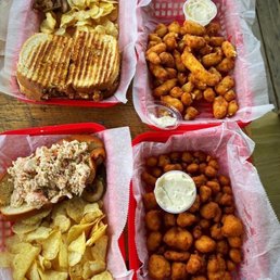 Clockwise from top left: chicken cordon bleu sandwich, cheese curds, breaded cauliflower & lobster roll. Clockwise from top left: chicken cordon bleu sandwich, cheese curds, breaded cauliflower & lobster roll.