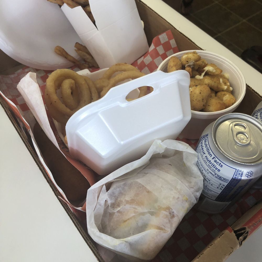 Miss Alfred - a box of food and a can of soda - Poutineries Near Me - Alfred, Ontario