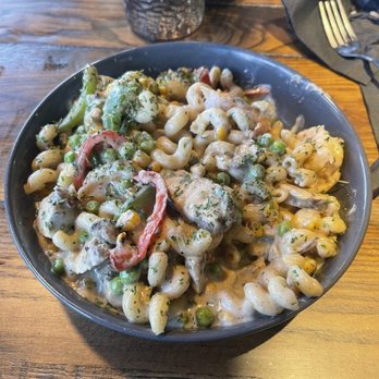 Zeke's Kitchen & Bar - Rasta Pasta with jerk chicken and shrimp. Add corn and peas - New American Near Me - Smyrna, Georgia Zeke's Kitchen & Bar - Rasta Pasta with jerk chicken and shrimp. Add corn and peas - New American Near Me - Smyrna, Georgia