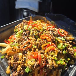The Kryptonite Fries. Seasoned beef, crispy fries, scallions, and the perfect spiced aioli. 10/10.