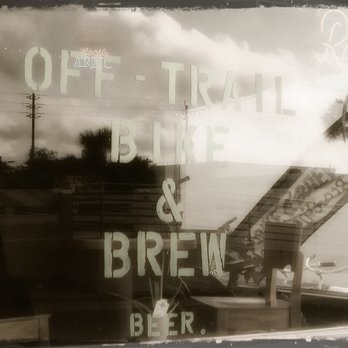 Off -Trail Bike & Brew - reflection in window - Beer Bar Near Me - Venice, Florida Off -Trail Bike & Brew - reflection in window - Beer Bar Near Me - Venice, Florida