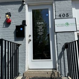 Front door - ring bell and go up the stairs.