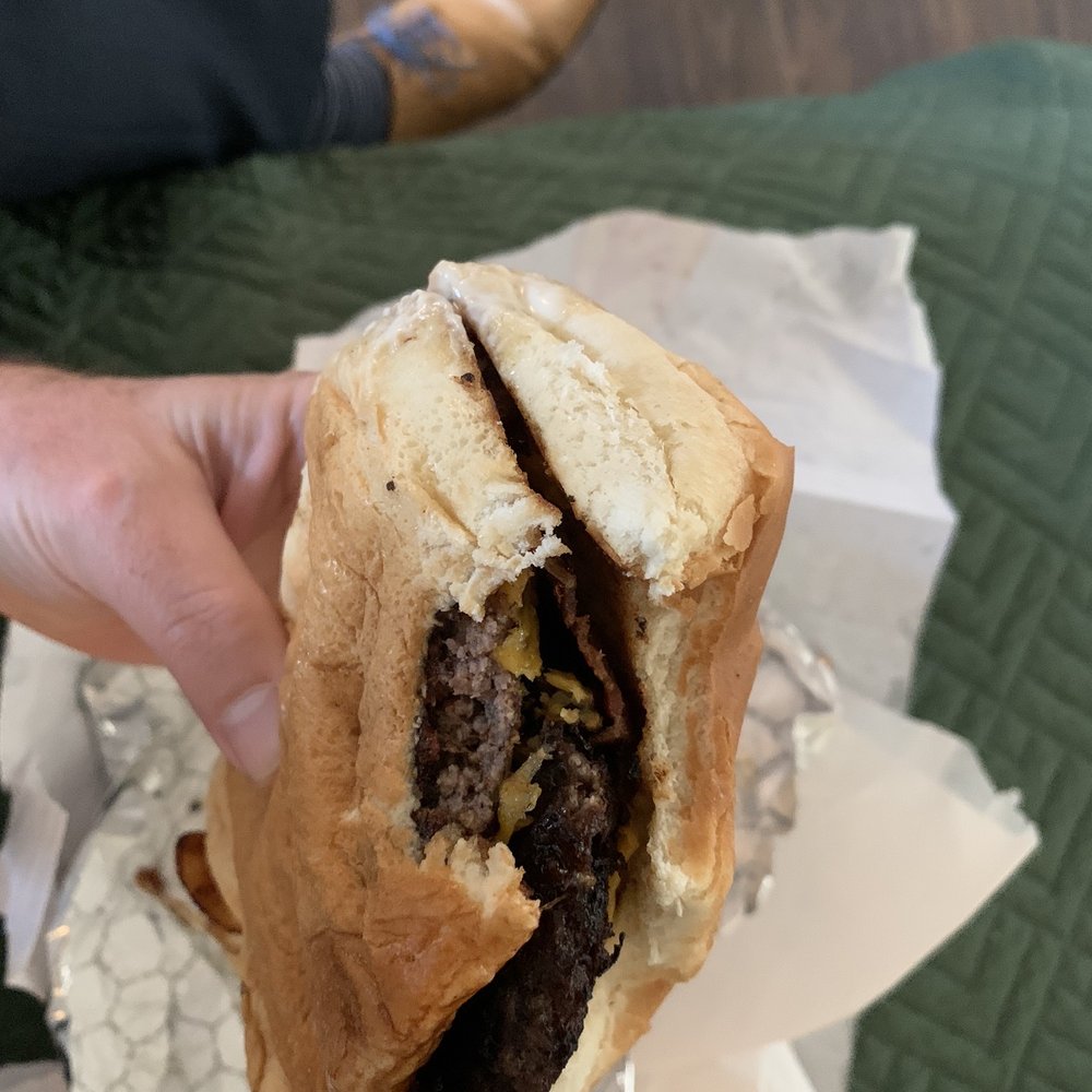 Zip's Drive-In - a hand holding a sandwich - Breakfast & Brunch Near Me - Colville, Washington Zip's Drive-In - a hand holding a sandwich - Breakfast & Brunch Near Me - Colville, Washington