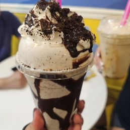 Oreo milkshake with extra oreos. Caramel milkshake in the back Oreo milkshake with extra oreos. Caramel milkshake in the back