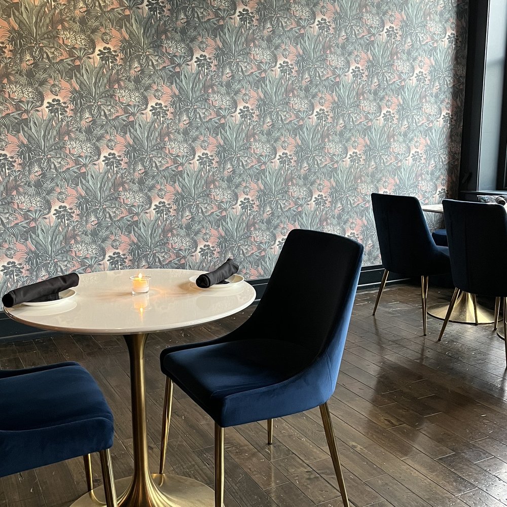 Waxlight Bar A Vin - a table and chairs - Wine Bars Near Me - Buffalo, New York Waxlight Bar A Vin - a table and chairs - Wine Bars Near Me - Buffalo, New York