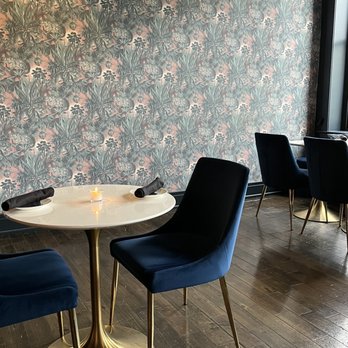 Waxlight Bar A Vin - a table and chairs - Wine Bars Near Me - Buffalo, New York