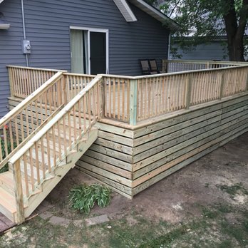 Manage Scapes - a wooden deck with stairs - Landscaping Near Me Manage Scapes - a wooden deck with stairs - Landscaping Near Me