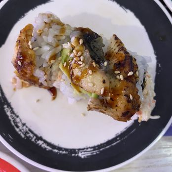 Genki Sushi - Three pieces of a dragon roll, only one of which actually had avocado on it... - Sushi Bars Near Me - Kaneohe, Hawaii