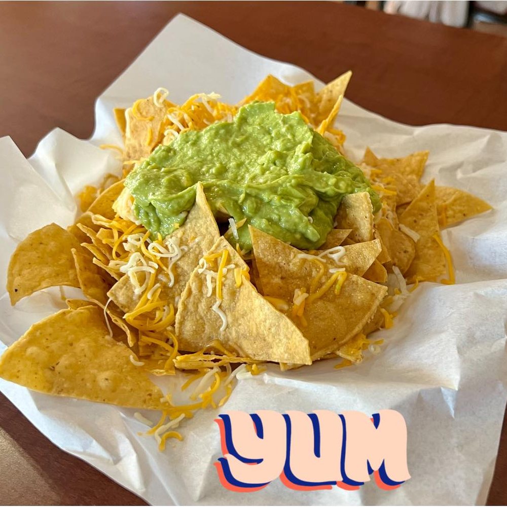 Pavlos Tacos - a plate of nachos with guacamole - Mexican Near Me - Encinitas, California