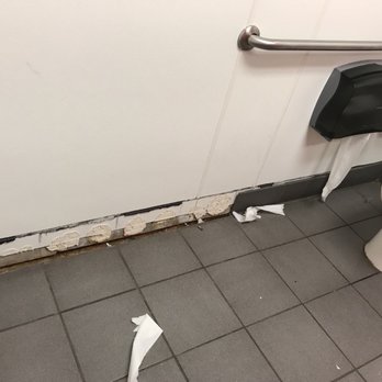 Chuck E. Cheese - a bathroom with a toilet and a roll of toilet paper - Pizza Near Me - Superior, Colorado