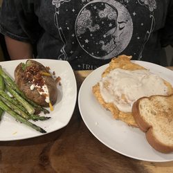 Mr. Bones Restaurant & Bar - Chicken fried chicken with grilled asparagus and fully loaded baked potatoes
