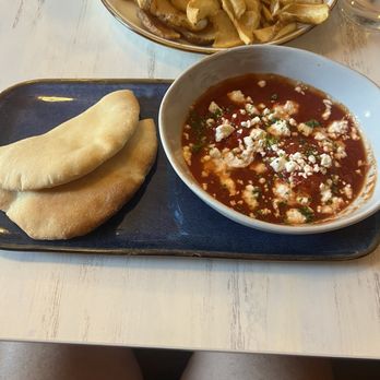 Mood Restaurant & Cafe - Shakshuka 2 perfectly poached eggs with spiced tomatoes topped with feta. - Coffee & Tea Near Me - Boston, Massachusetts Mood Restaurant & Cafe - Shakshuka 2 perfectly poached eggs with spiced tomatoes topped with feta. - Coffee & Tea Near Me - Boston, Massachusetts