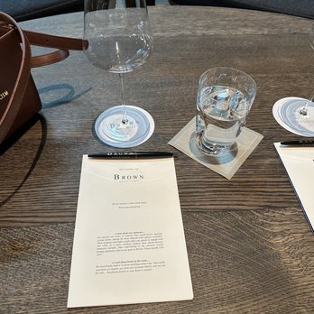 Brown Downtown Napa - This is all about the wine glasses...they are literally feather light!! Read the paper in the pic to learn why! - Wine Bars Near Me - Napa, California