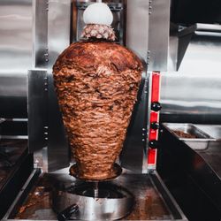 Taqueria Chicali Mexican Grill - Al Pastor Cooked on the trompo the Authentic way with our signature Adobo recipe made from scratch in house.