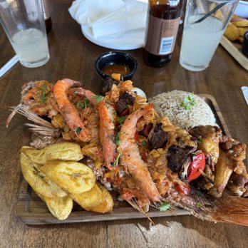 Zola Cultural Kitchen - Red fish topped with shrimp, with beef kabob, chicken wings, plantain and rice - African Near Me - Mesa, Arizona Zola Cultural Kitchen - Red fish topped with shrimp, with beef kabob, chicken wings, plantain and rice - African Near Me - Mesa, Arizona