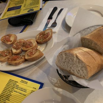 Boca Juniors Restaurant - Bread with a lemony tomato sauce and fresh bread - Argentine Near Me - Elmhurst, New York