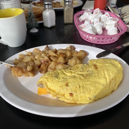 Sausage & cheese omelette with hash browns.