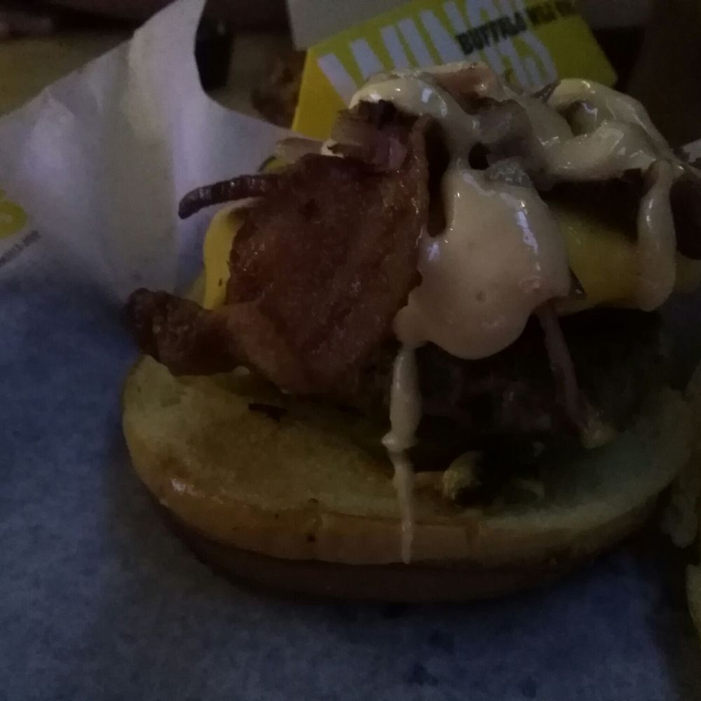 a burger with cheese and bacon