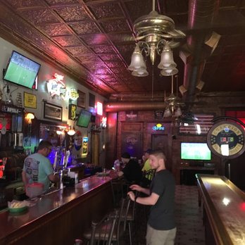 The Atlas Saloon - a man standing at the bar - Breweries Near Me - Excelsior Springs, Missouri