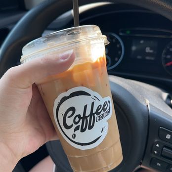 Coffee Bound - a hand holding a cup of coffee - Coffee & Tea Near Me - Schertz, Texas