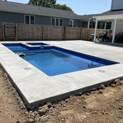 Buff City Pools - Fiberglass install with additional concrete decking