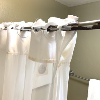 Plantation Hale Suites - Rusted curtain rod and frayed shower curtain - Hotels Near Me - Kapaa, Hawaii Plantation Hale Suites - Rusted curtain rod and frayed shower curtain - Hotels Near Me - Kapaa, Hawaii