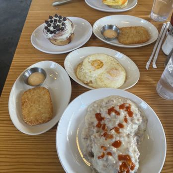 Bomb Biscuit - Biscuits and gravy, Egg & Cheddar, hash browns, cinnamon roll - Breakfast & Brunch Near Me - Atlanta, Georgia