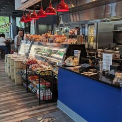 Attman's Deli Harbor Point - Interior by the cash register and deli meats