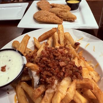 Fat Jack's - Loaded Fries and Chicken Tenders. The yellow sauce is honey mustard and the white sauce is ranch dressing - Steakhouses Near Me - Walterboro, South Carolina Fat Jack's - Loaded Fries and Chicken Tenders. The yellow sauce is honey mustard and the white sauce is ranch dressing - Steakhouses Near Me - Walterboro, South Carolina
