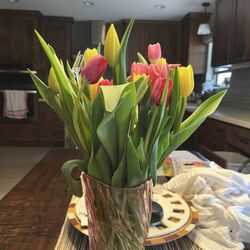 As pretty as they are, I could've bought flowers and thrown them into a vase. Leaves were not stripped and flowers were bunched too tight.