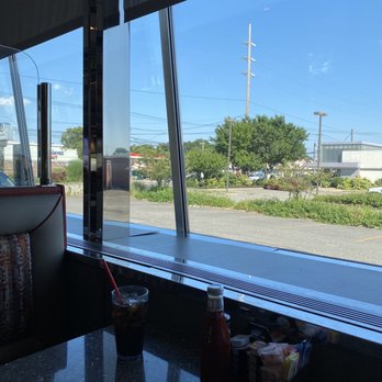 Omega Diner - View of the outdoors from our booth - Diners Near Me - New Hyde Park, New York Omega Diner - View of the outdoors from our booth - Diners Near Me - New Hyde Park, New York