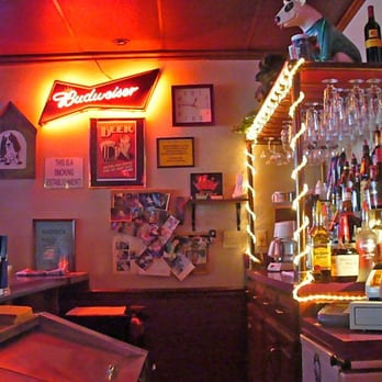 Doghouse Bar & Grille - a woman standing at the bar - Bars Near Me - Grandview, Missouri Doghouse Bar & Grille - a woman standing at the bar - Bars Near Me - Grandview, Missouri
