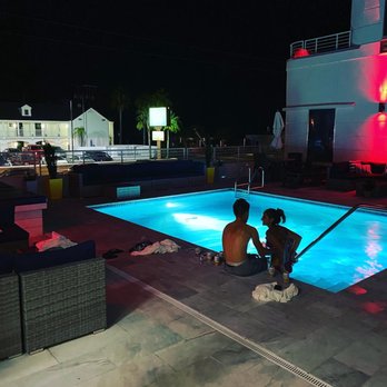 BLVD Bistro & Bar - two people sitting by a swimming pool - Tapas/Small Plates Near Me - St. Augustine, Florida