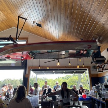 Moonlite Bay - Garage door opening out to the outdoor seating, plus a boat on the ceiling - American Near Me - Crosslake, Minnesota