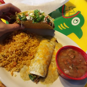 Fuzzy's Taco Shop - Combo plate. Hard shell ground beef taco with a pork enchilada sided with borracho beans and mix mex rice. - Mexican Near Me - Des Moines, Iowa Fuzzy's Taco Shop - Combo plate. Hard shell ground beef taco with a pork enchilada sided with borracho beans and mix mex rice. - Mexican Near Me - Des Moines, Iowa