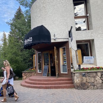 Russell's - Outside the restaurant with love music and shopping steps from the front door. - Steakhouses Near Me - Vail, Colorado Russell's - Outside the restaurant with love music and shopping steps from the front door. - Steakhouses Near Me - Vail, Colorado