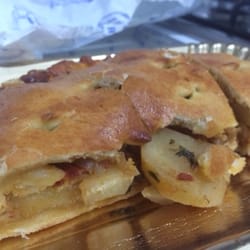 Snack Bar L'Angolo - Scaccia made with a lot of potato. You will have to search for the octopus & cuttlefish inside.