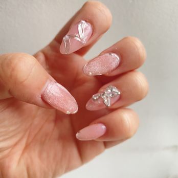 Coco Nails art - Gel tip extension, cat eye nail art, and diamond butterfly charm - Nail Salons Near Me - New York, New York Coco Nails art - Gel tip extension, cat eye nail art, and diamond butterfly charm - Nail Salons Near Me - New York, New York