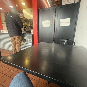 Little Dynamite - There is a small counter area for seating and the one table we are seated at. - Pizza Near Me - Los Angeles, California