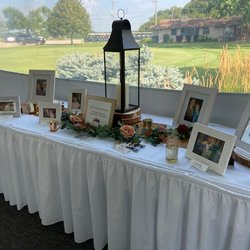 Memory Table.. all photos of Nate & Taylors loved ones that were there in spirit.. Was beautiful to display in hallway to the main tent.