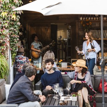 Pax Wines - Patio seating during a Live Music Friday event. - Wine Tasting Room Near Me - Sebastopol, California Pax Wines - Patio seating during a Live Music Friday event. - Wine Tasting Room Near Me - Sebastopol, California